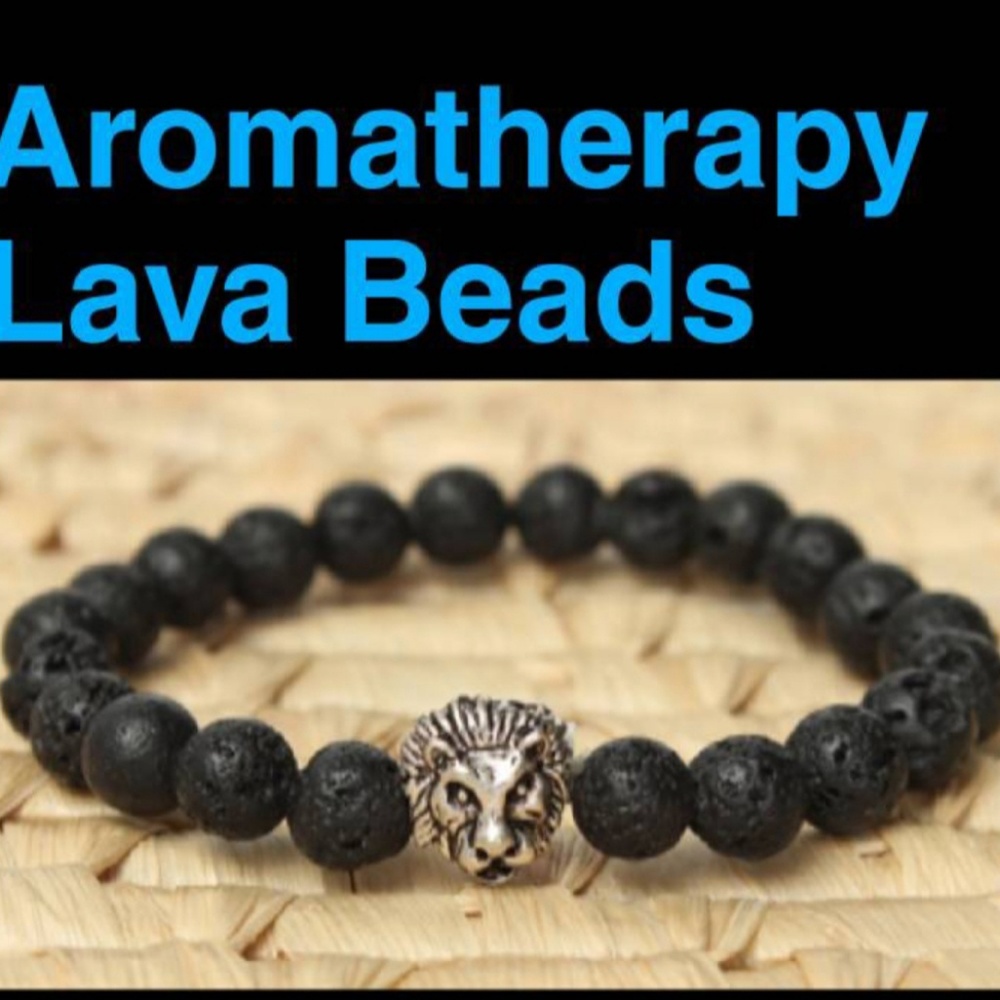 Lion bracelet silver charm and black lava beads.